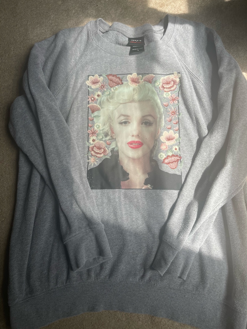 Torrid x Marilyn Monroe embroidered grey sweatshirt.